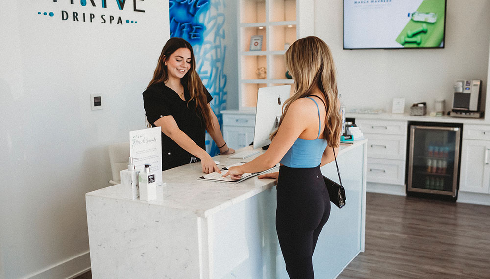 Woman checking in at thrive